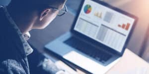 businessman-reads-report-study-data-chart-news