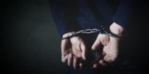 news-arrested-man-with-handcuffs