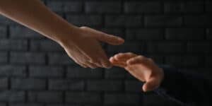 news-womans-hand-reaching