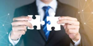 pieces-of-puzzle-joined-together-partnership-deal-m&a-acqusition-news